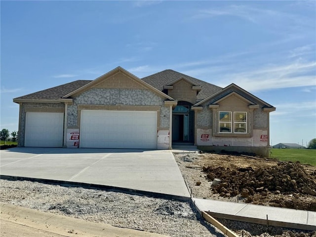 unfinished property with a garage, concrete driveway, and stone siding