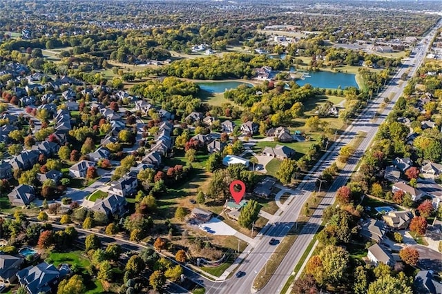 birds eye view of property featuring a water view and a residential view