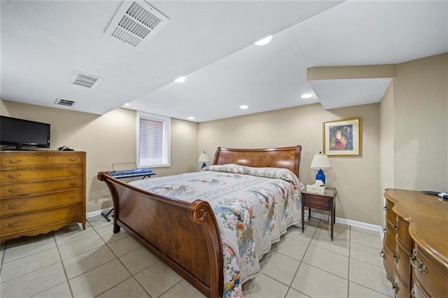 bedroom with baseboards, light tile patterned flooring, and visible vents
