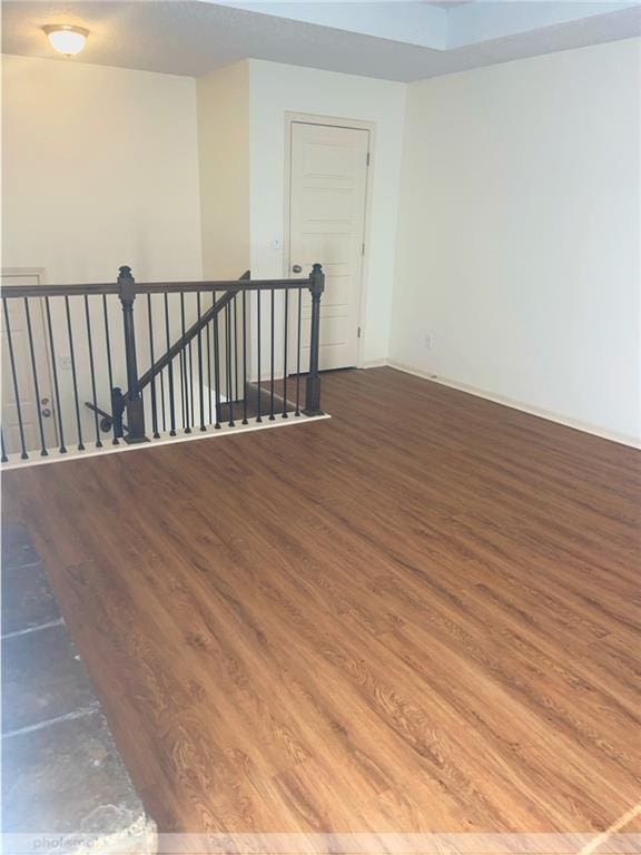 spare room with hardwood / wood-style flooring