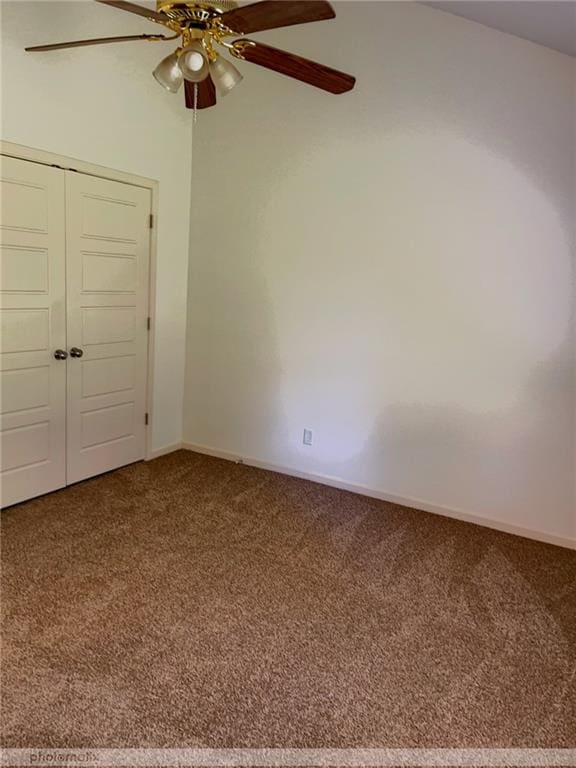 unfurnished bedroom featuring a closet, ceiling fan, and carpet floors