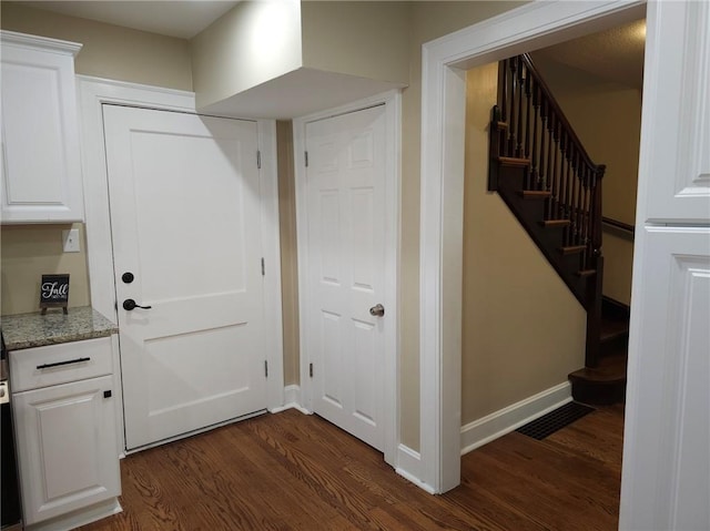 interior space with dark hardwood / wood-style floors