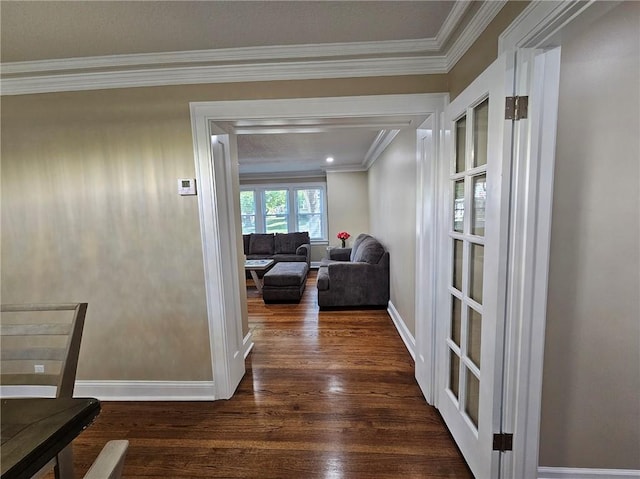 corridor featuring ornamental molding and dark hardwood / wood-style floors