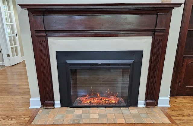 interior details featuring a fireplace and hardwood / wood-style floors