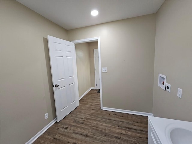 laundry room featuring hookup for a washing machine, dark wood-type flooring, and hookup for an electric dryer