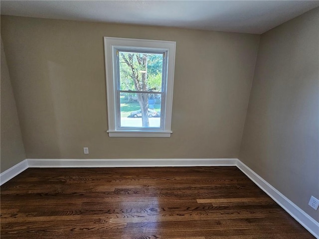 unfurnished room featuring dark hardwood / wood-style floors