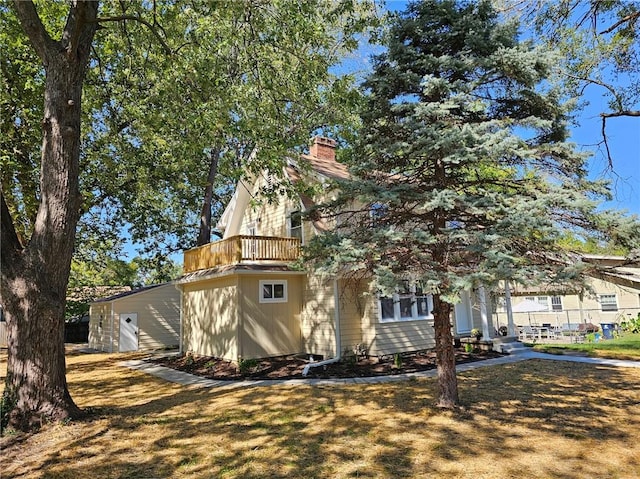 view of property exterior featuring a balcony