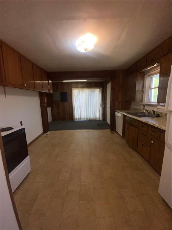 kitchen with white appliances and sink