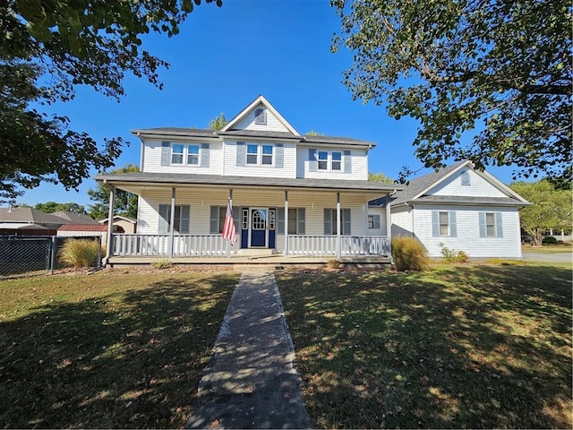 view of front of property with a front lawn and covered porch