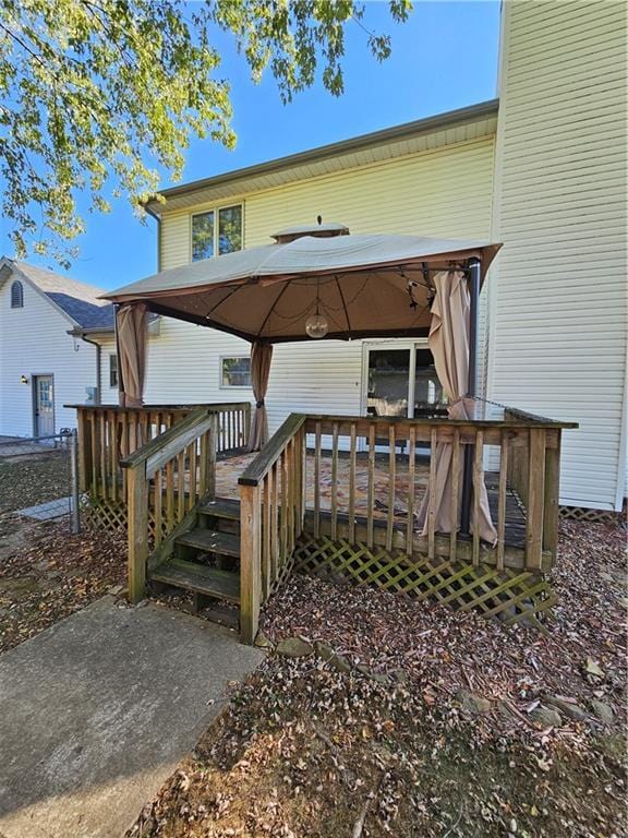 back of property with a wooden deck