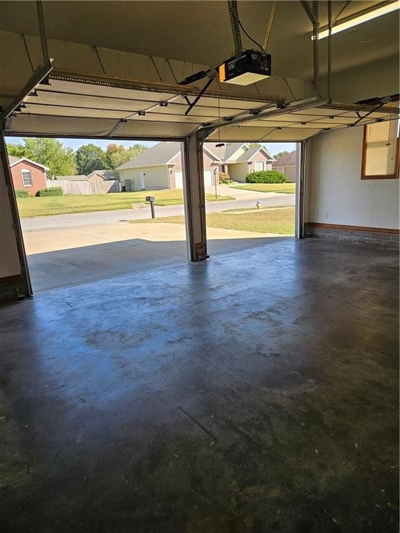 garage featuring a garage door opener and a carport