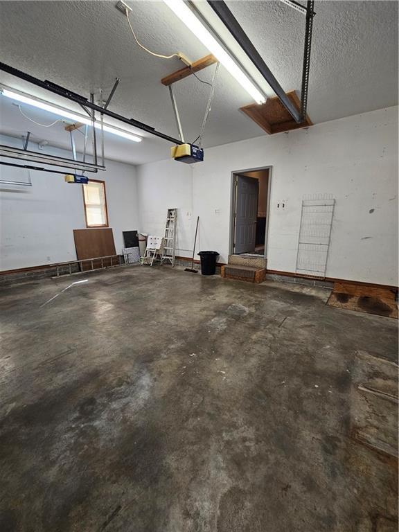 2007 Windsor Dr, Pittsburg, KS 66762 - garage featuring a garage door opener