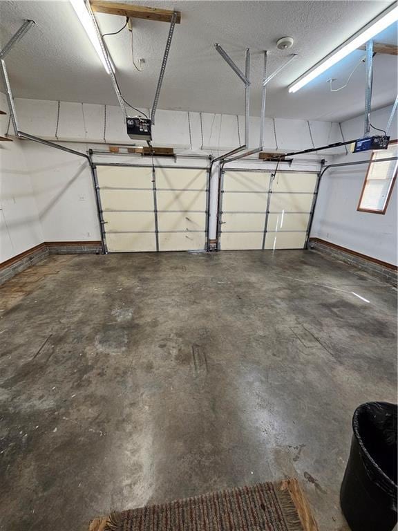2007 Windsor Dr, Pittsburg, KS 66762 - garage featuring a garage door opener and baseboards