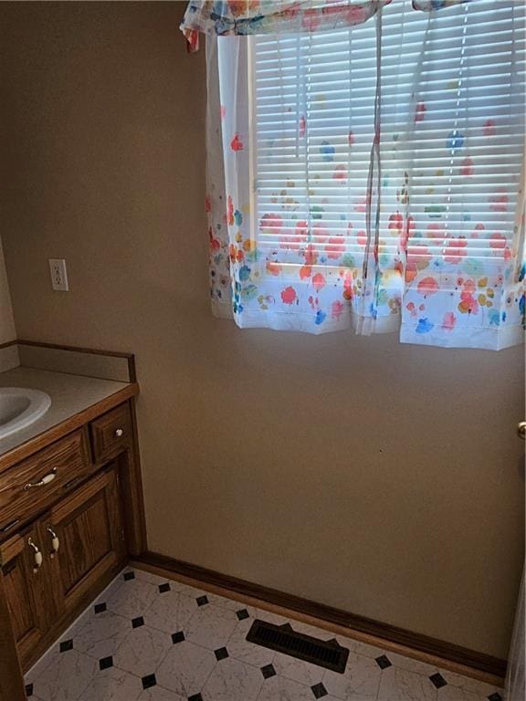 2007 Windsor Dr, Pittsburg, KS 66762 - bathroom with baseboards and vanity