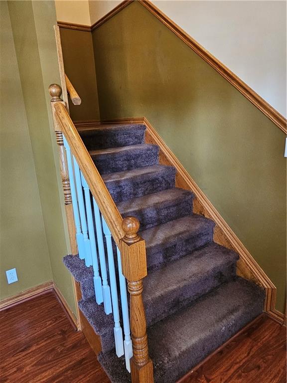2007 Windsor Dr, Pittsburg, KS 66762 - stairway featuring wood finished floors and baseboards