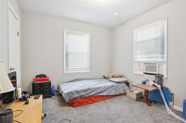 bedroom featuring cooling unit and carpet