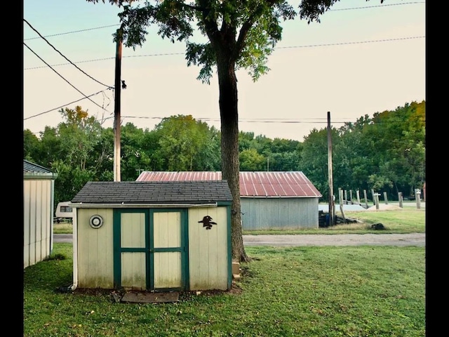 view of outbuilding featuring a lawn