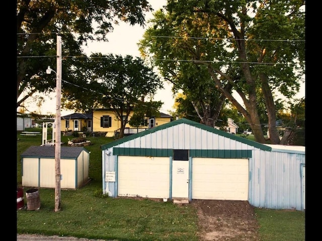 garage featuring a yard