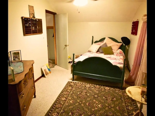 bedroom featuring carpet, lofted ceiling, and ceiling fan