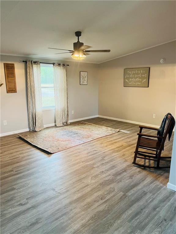 unfurnished room with ornamental molding, ceiling fan, and hardwood / wood-style flooring