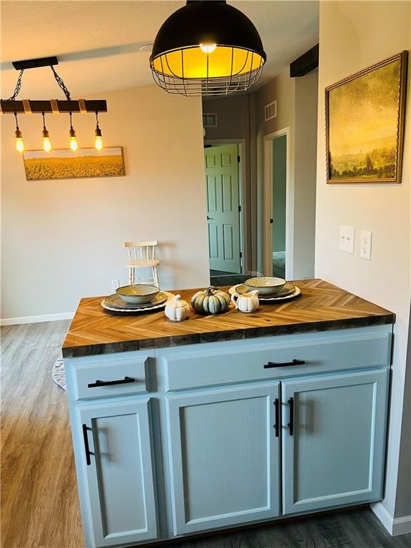 bathroom featuring hardwood / wood-style flooring and vanity