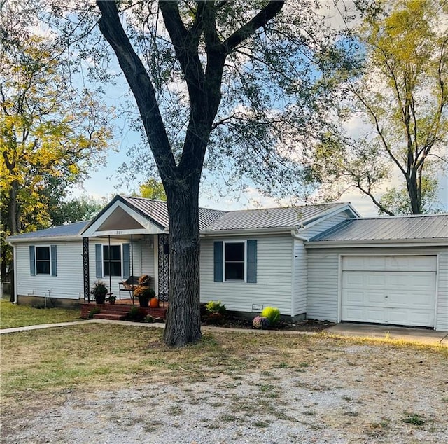 ranch-style home with a front yard and a garage