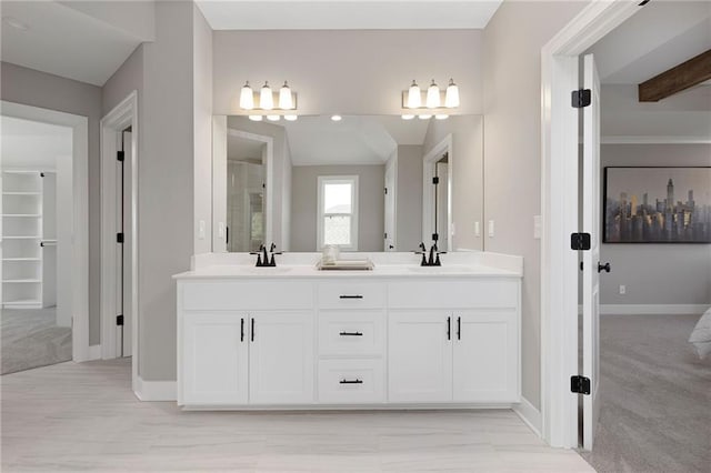 31409 W 85th Ter, De Soto, KS 66018 - full bathroom featuring baseboards, a sink, a shower, and double vanity