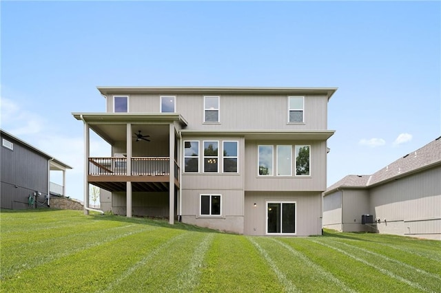 31409 W 85th Ter, De Soto, KS 66018 - rear view of house featuring ceiling fan and a lawn