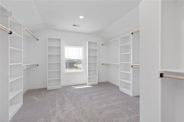 31409 W 85th Ter, De Soto, KS 66018 - walk in closet with lofted ceiling, visible vents, and carpet flooring