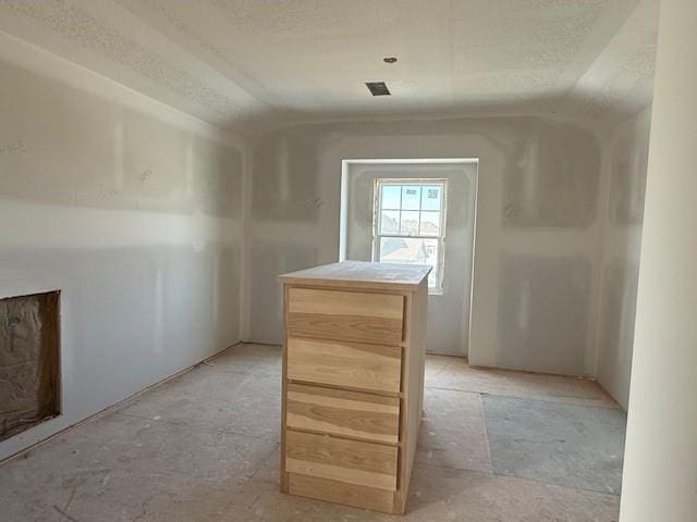 additional living space featuring lofted ceiling