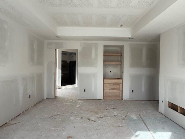 empty room with a raised ceiling