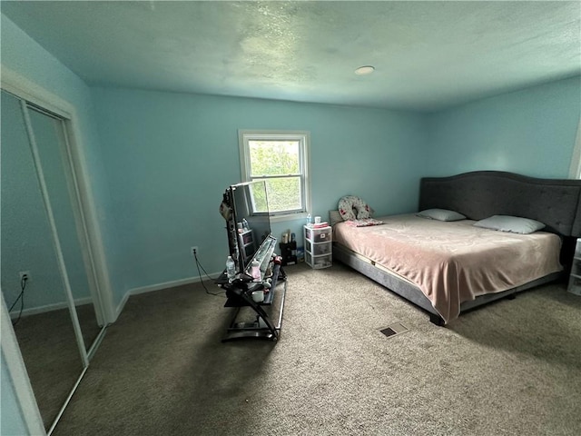 carpeted bedroom featuring a closet