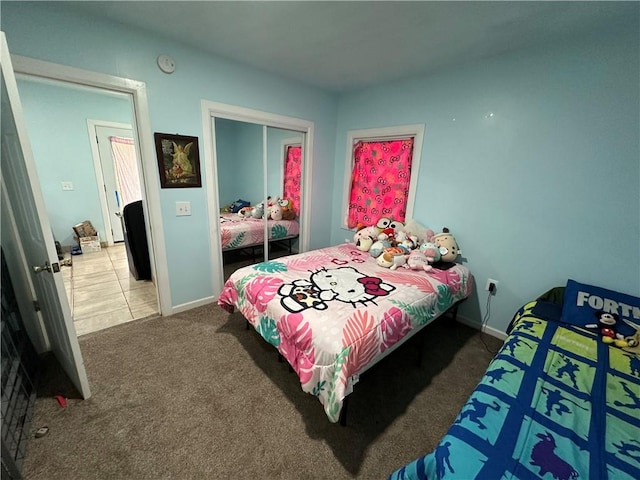 bedroom featuring carpet and a closet