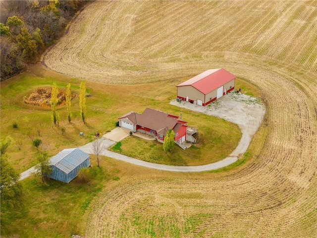 birds eye view of property featuring a rural view