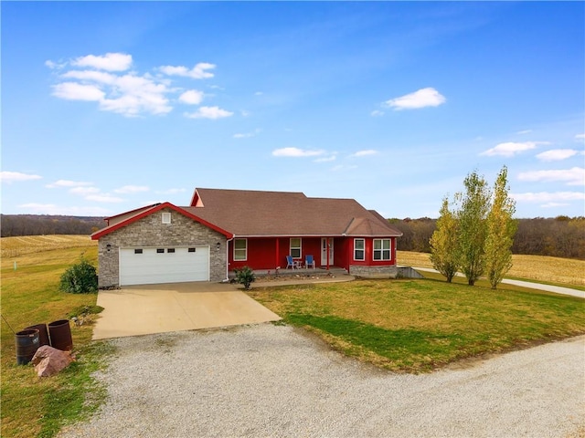 ranch-style home with a garage, a front lawn, and a porch