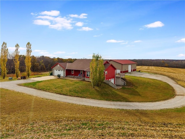 view of front of house with a garage and a front lawn