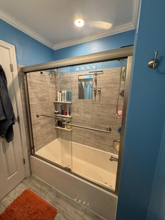 bathroom featuring crown molding, combined bath / shower with glass door, and tile patterned floors