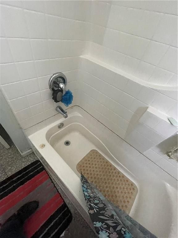 bathroom with shower / bathtub combination