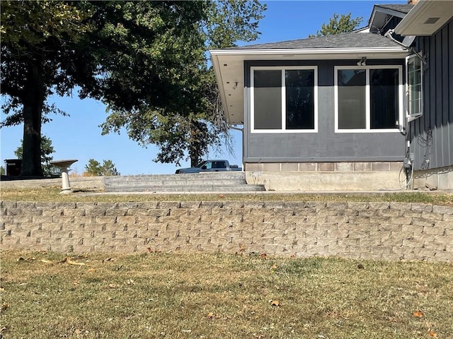 view of property exterior featuring a yard