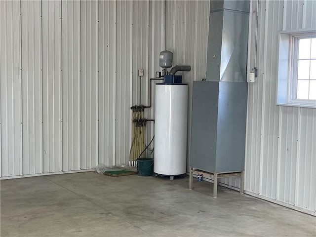 utility room featuring water heater