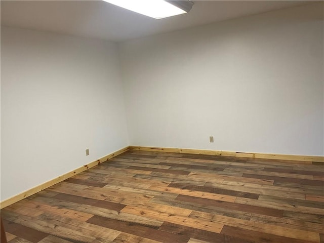 empty room with hardwood / wood-style floors