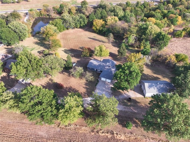 birds eye view of property featuring a rural view and a water view