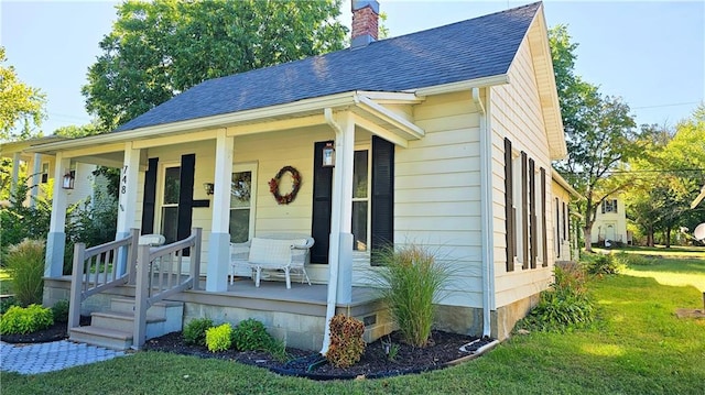 exterior space featuring a front yard and a porch