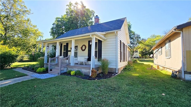 bungalow-style house with covered porch and a front yard