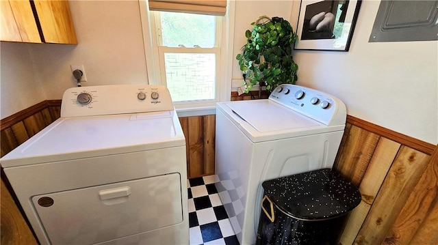 washroom featuring washer and clothes dryer and electric panel