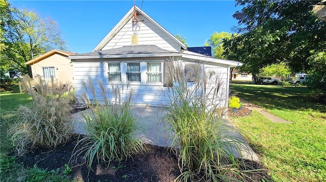 view of property exterior with a yard