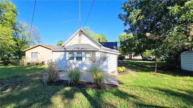 back of house with a yard