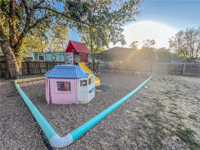 1201 S Willow St, Coffeyville, KS 67337 - view of play area with a fenced backyard