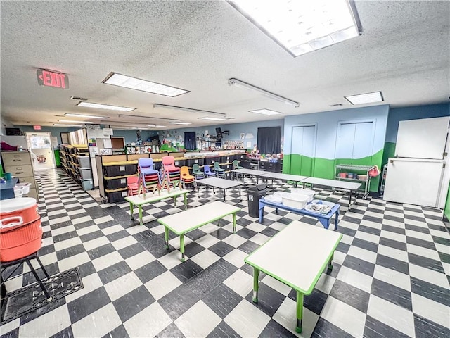 1201 S Willow St, Coffeyville, KS 67337 - miscellaneous room with tile patterned floors and a textured ceiling