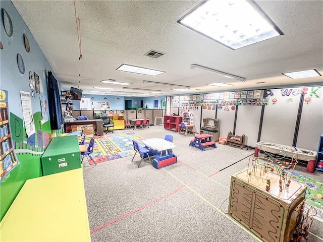 rec room with a textured ceiling